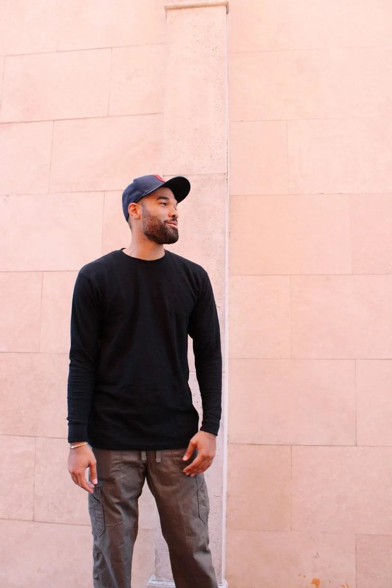 Man wearing Gman USA black long sleeve shirt — wholesale streetwear basics