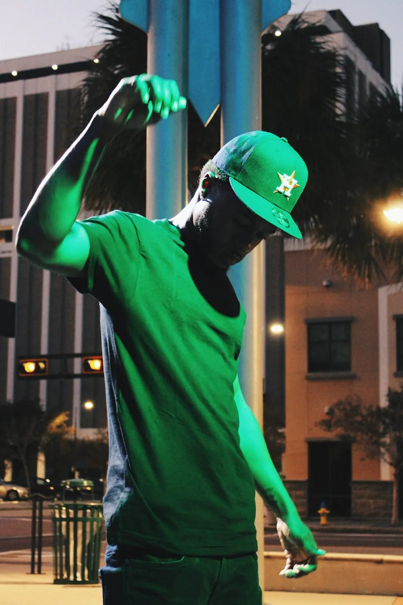 Man wearing Gman USA green Dri-Fit t-shirt — bulk wholesale pricing